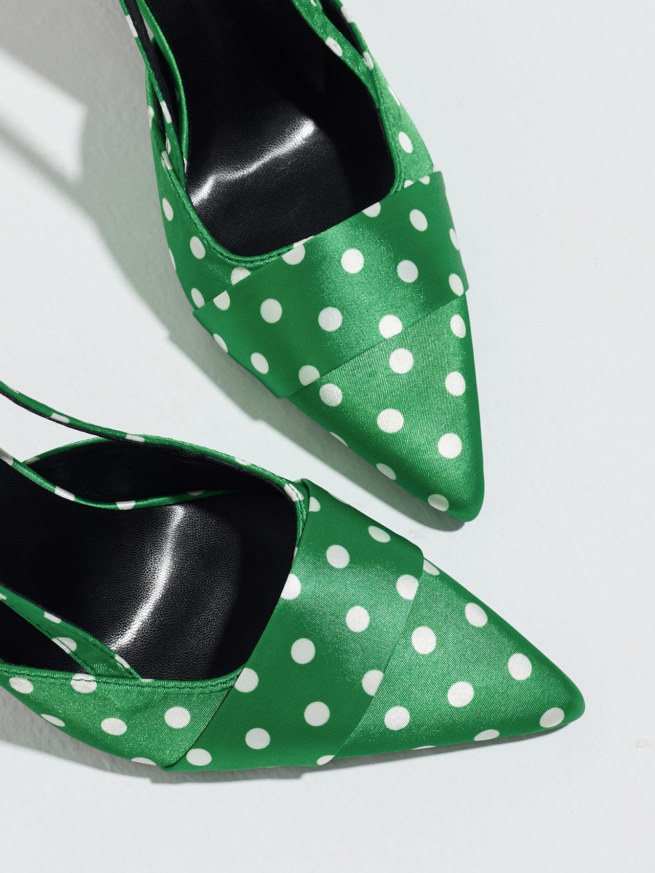 Mescini green polka dot slingback stiletto heels, close up of the pointed satin toes, US women's sizes