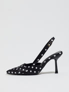 Mescini black polka dot slingback stiletto heels, single shoe in profile on white, US women's sizes