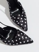 Mescini black polka dot slingback stiletto heels, close up of the pointed toe and vamp, US women's sizes
