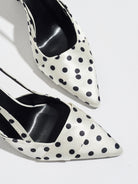 Mescini white polka dot slingback stiletto heels, close up of the tapered pointed toes, US women's sizes