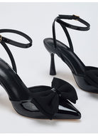 Mescini – Black bow pumps, close view of the bow and flared heel, US women's sizes