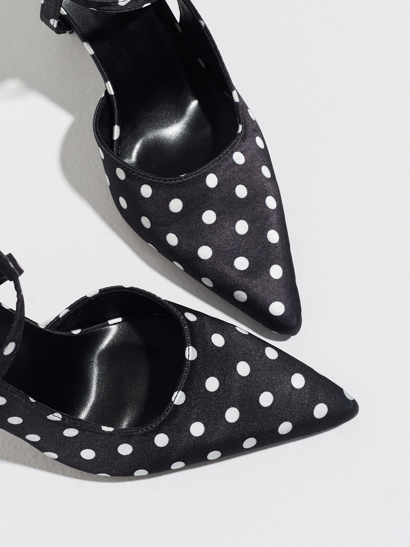Mescini black polka dot slingback heels, close view of the two pointed toes, US women's sizes