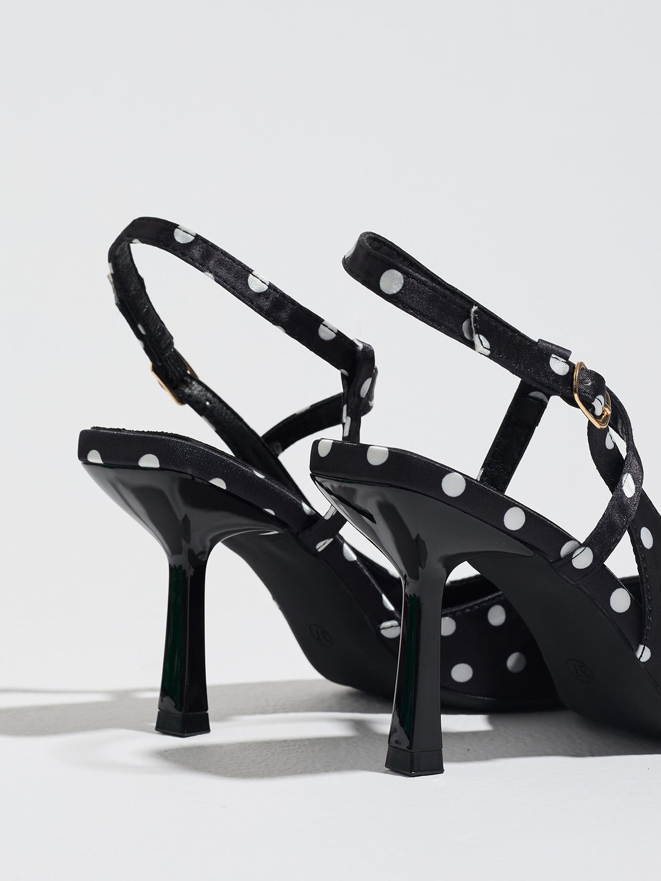 Mescini black polka dot slingback heels, rear view of the standing pair, US women's sizes