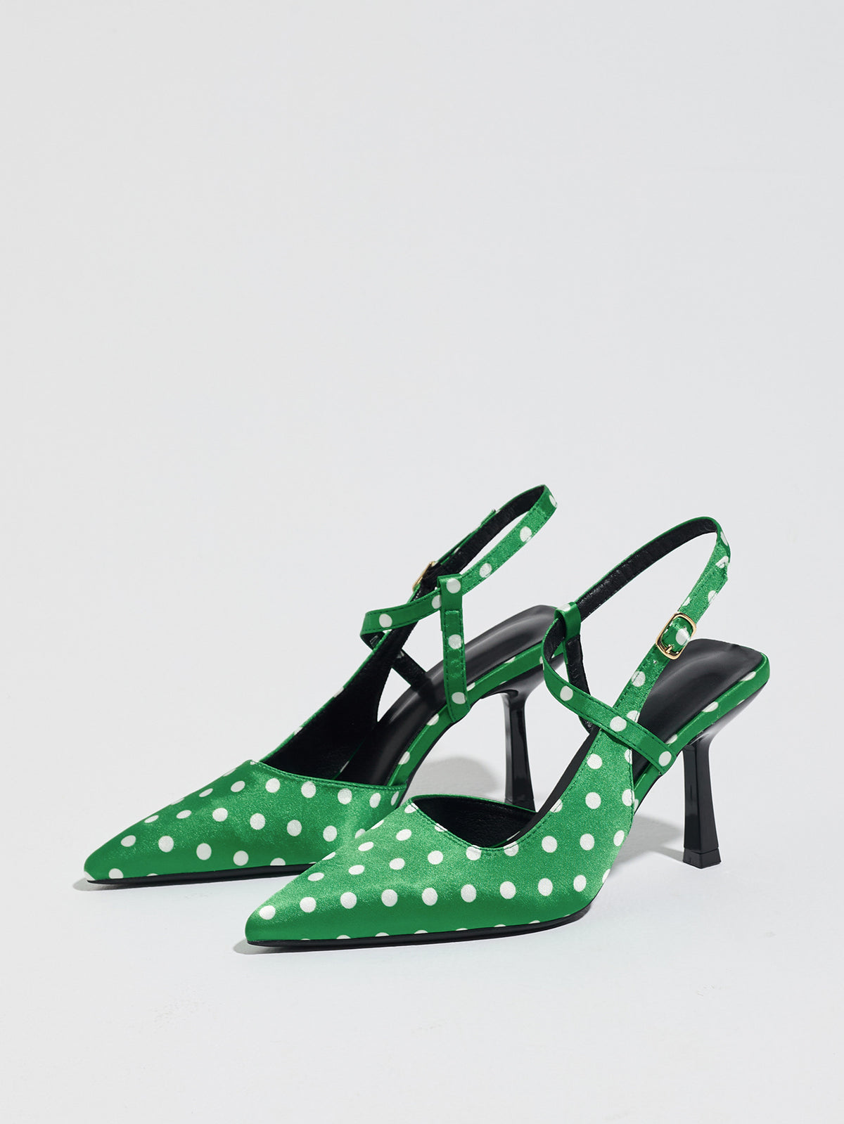 Mescini green polka dot pointed toe slingback heels, angled pair on white, US women's sizes