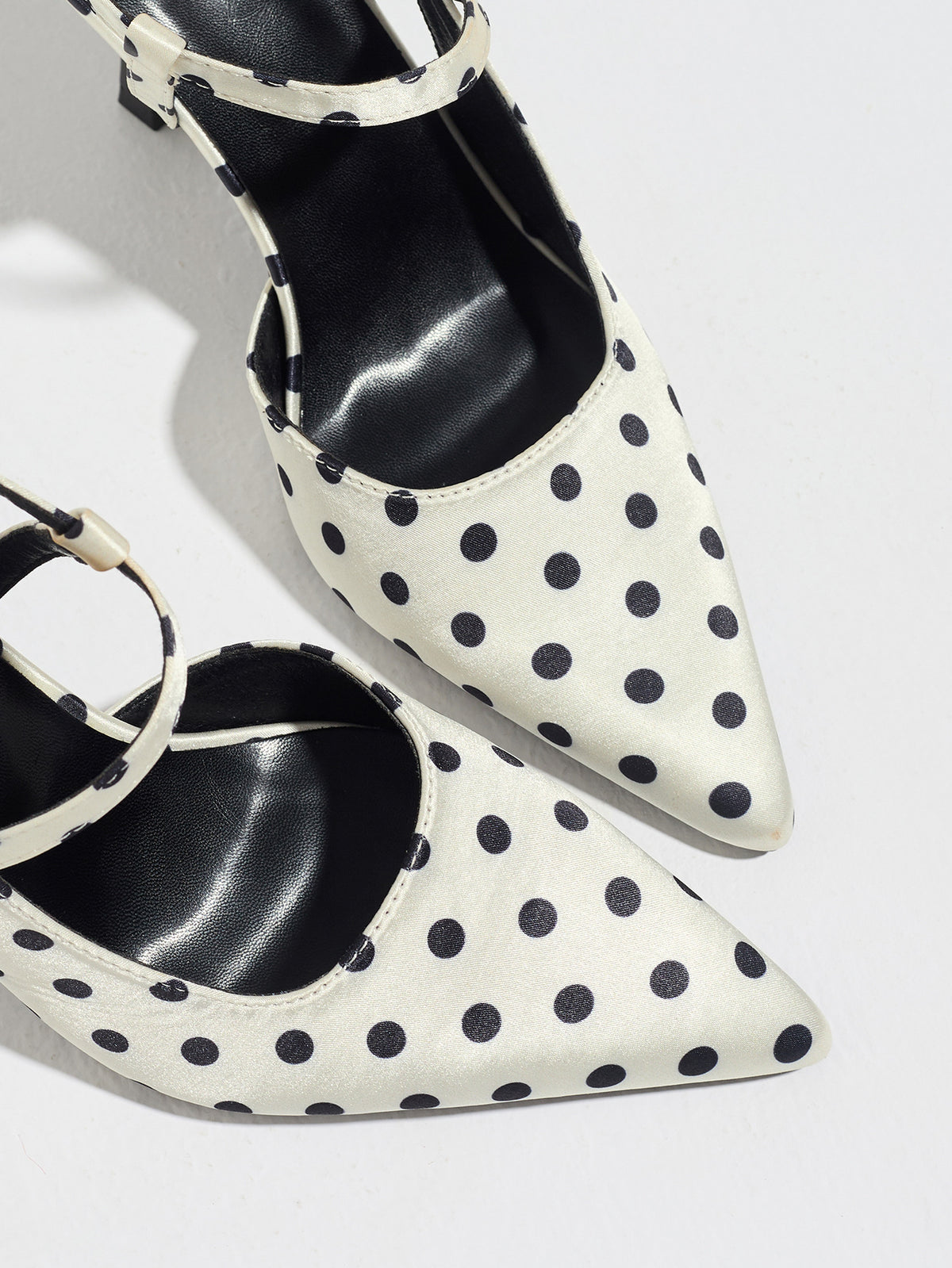 Mescini white polka dot slingback heels, close view of the two pointed toes, US women's sizes