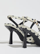 Mescini white polka dot slingback heels, rear view of the standing pair, US women's sizes