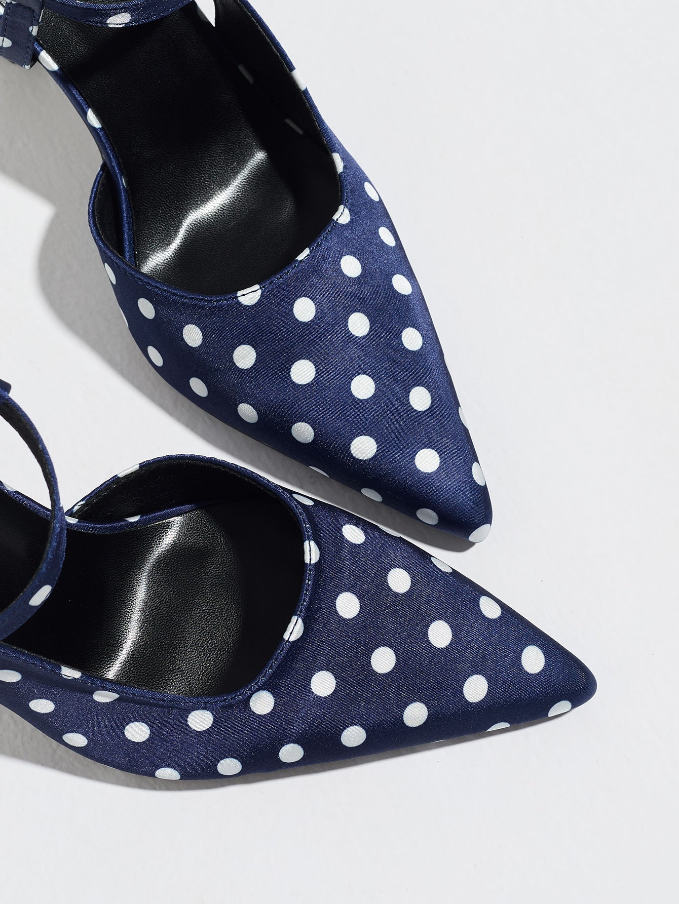 Mescini navy polka dot slingback heels, close view of the two pointed toes, US women's sizes