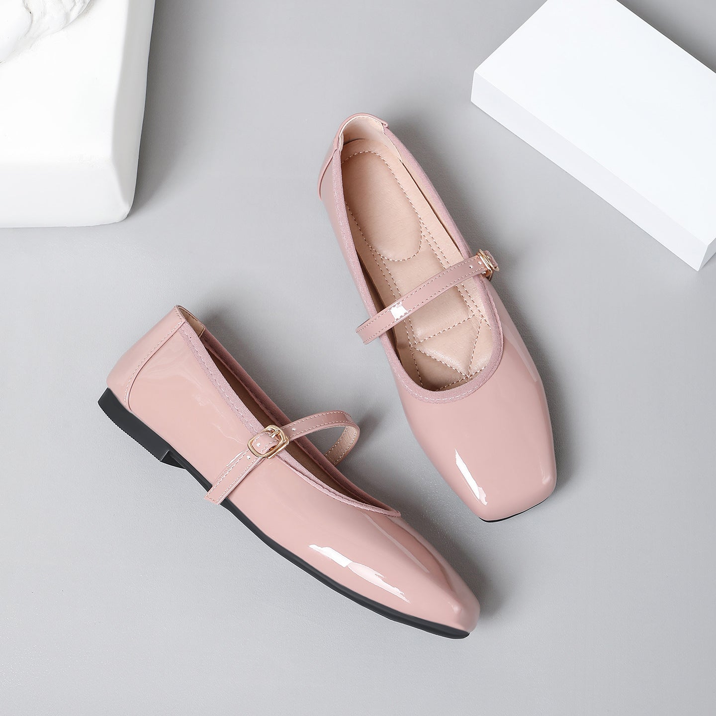 Mescini pink patent square toe mary jane flats, pair seen from above on grey, US women's sizes