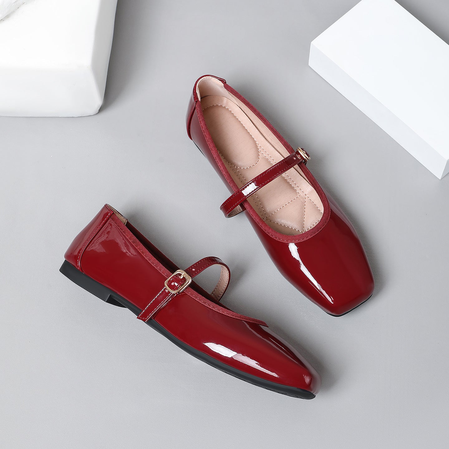 Mescini wine red patent square toe mary jane flats, pair with one shoe lying on its side, US women's sizes