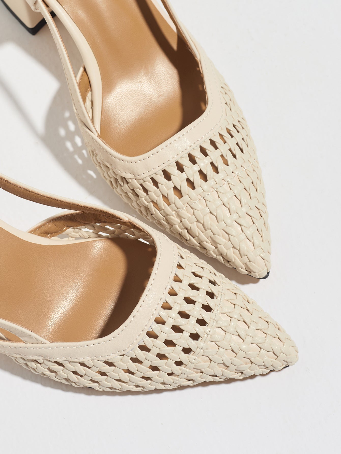 Mescini off-white woven block heel pumps, close view of the pointed toe, US women's sizes