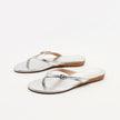 Mescini silver toe post low heel slide sandals, the pair angled on a white background, US women's sizes