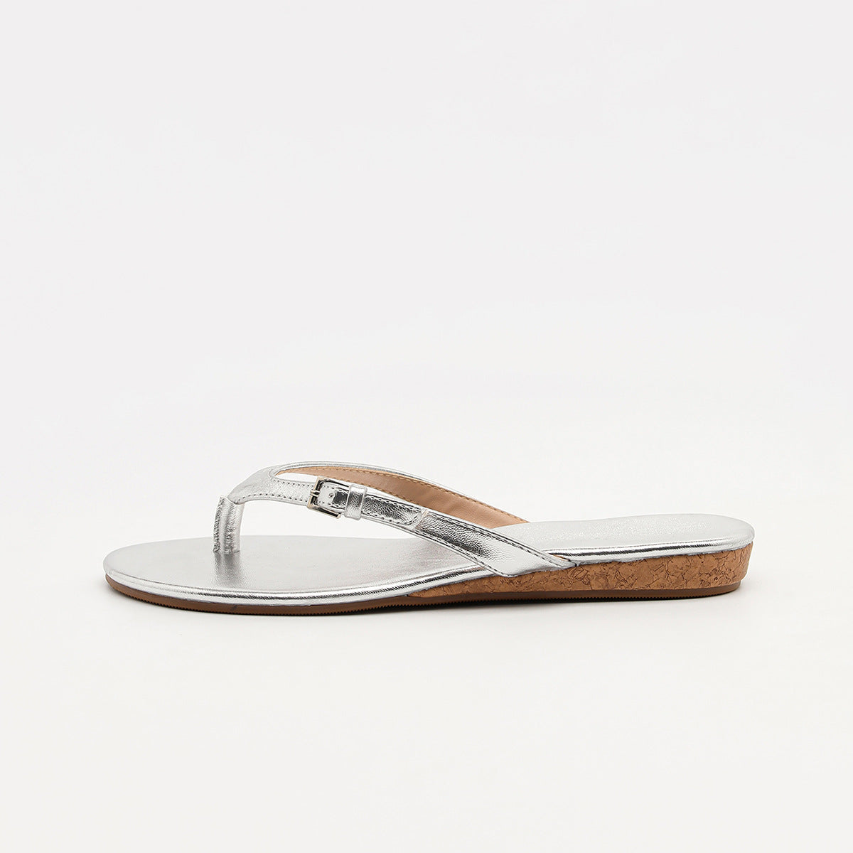Mescini silver toe post low heel slide sandals, a single shoe seen from the side, US women's sizes