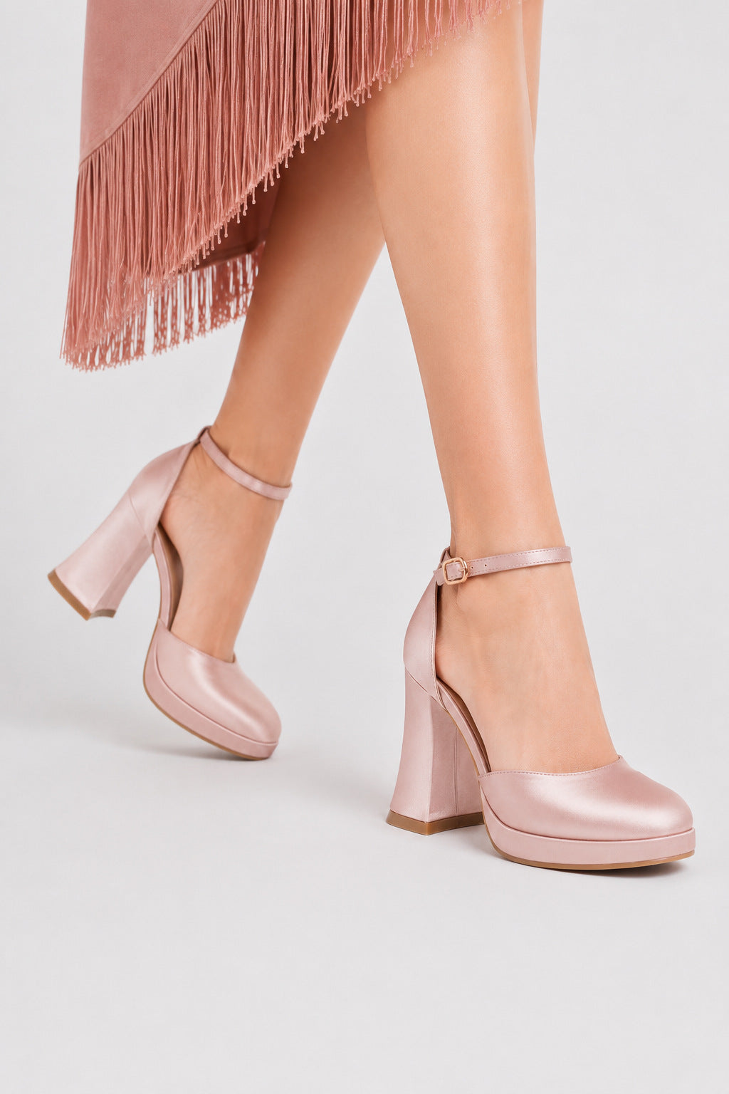 Mescini pink satin platform Mary Jane heels, worn walking, seen from the side, US women's sizes