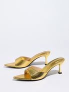 Mescini gold metallic pointed toe mule sandals, pair posed on a white background, US women's sizes
