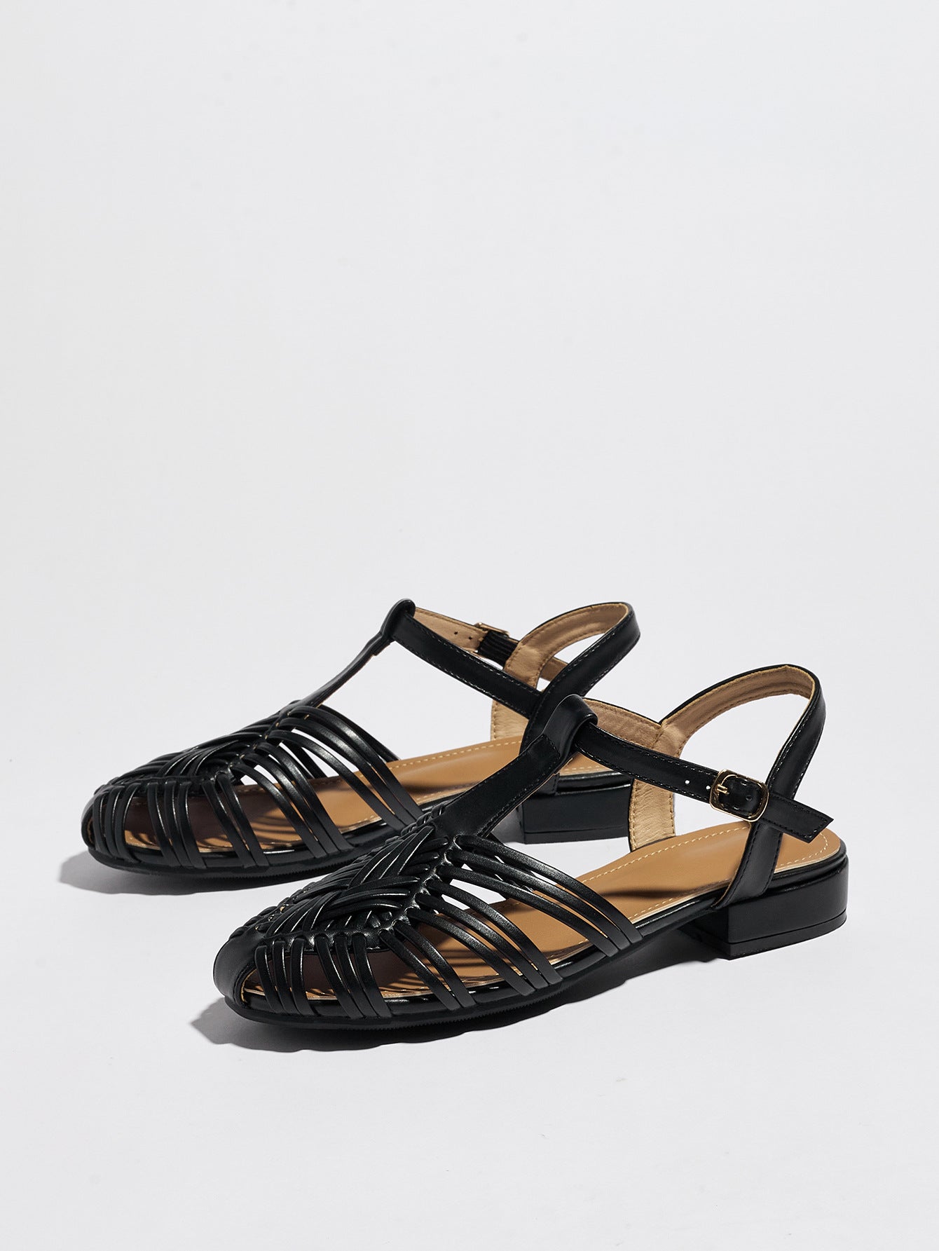 Mescini black woven closed toe block heel sandals, pair angled and seen from above, US women's sizes