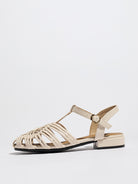 Mescini beige woven closed toe block heel sandals, single shoe turned to the side, US women's sizes