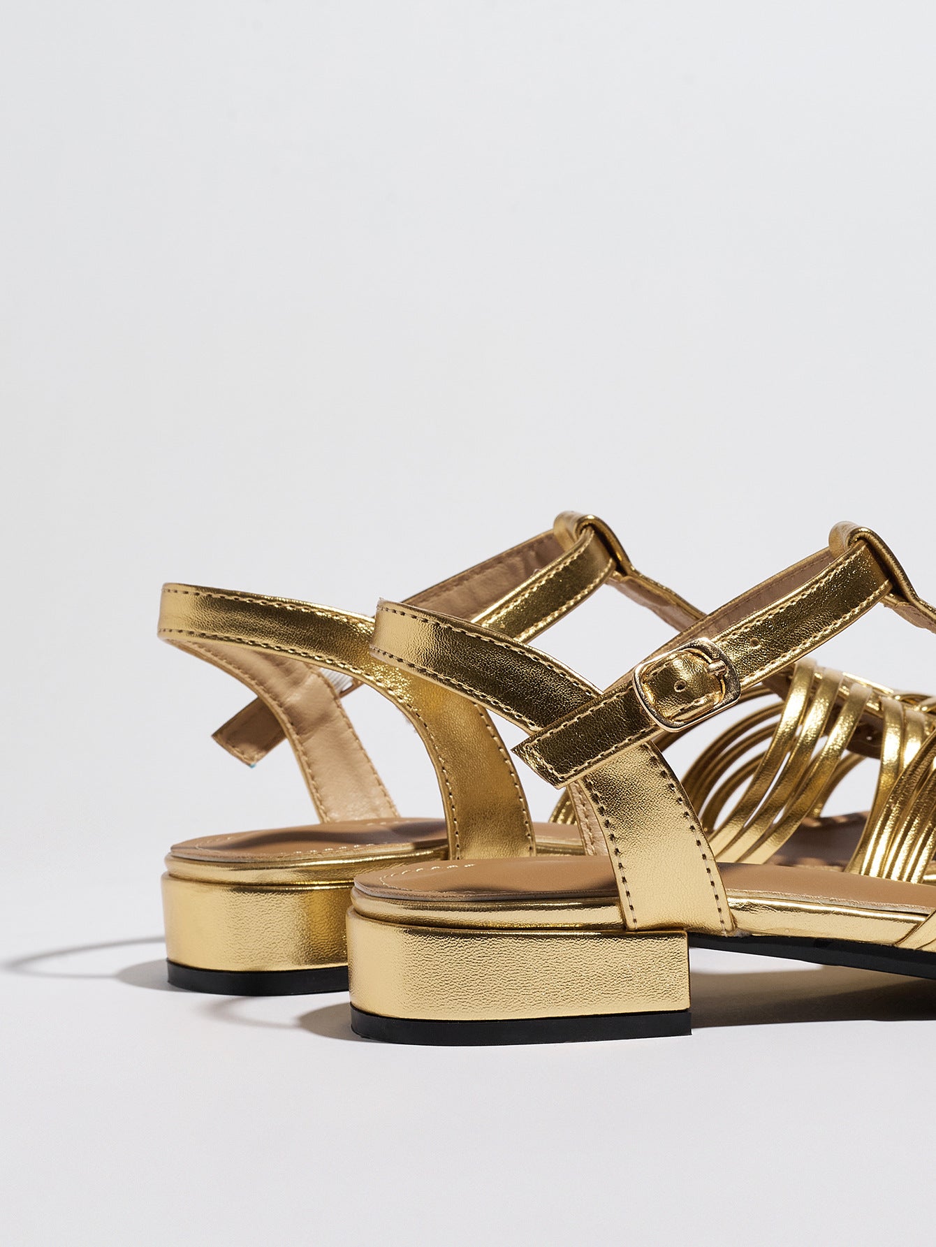 Mescini gold woven closed toe block heel sandals, pair from behind with the slingback strap, US women's sizes
