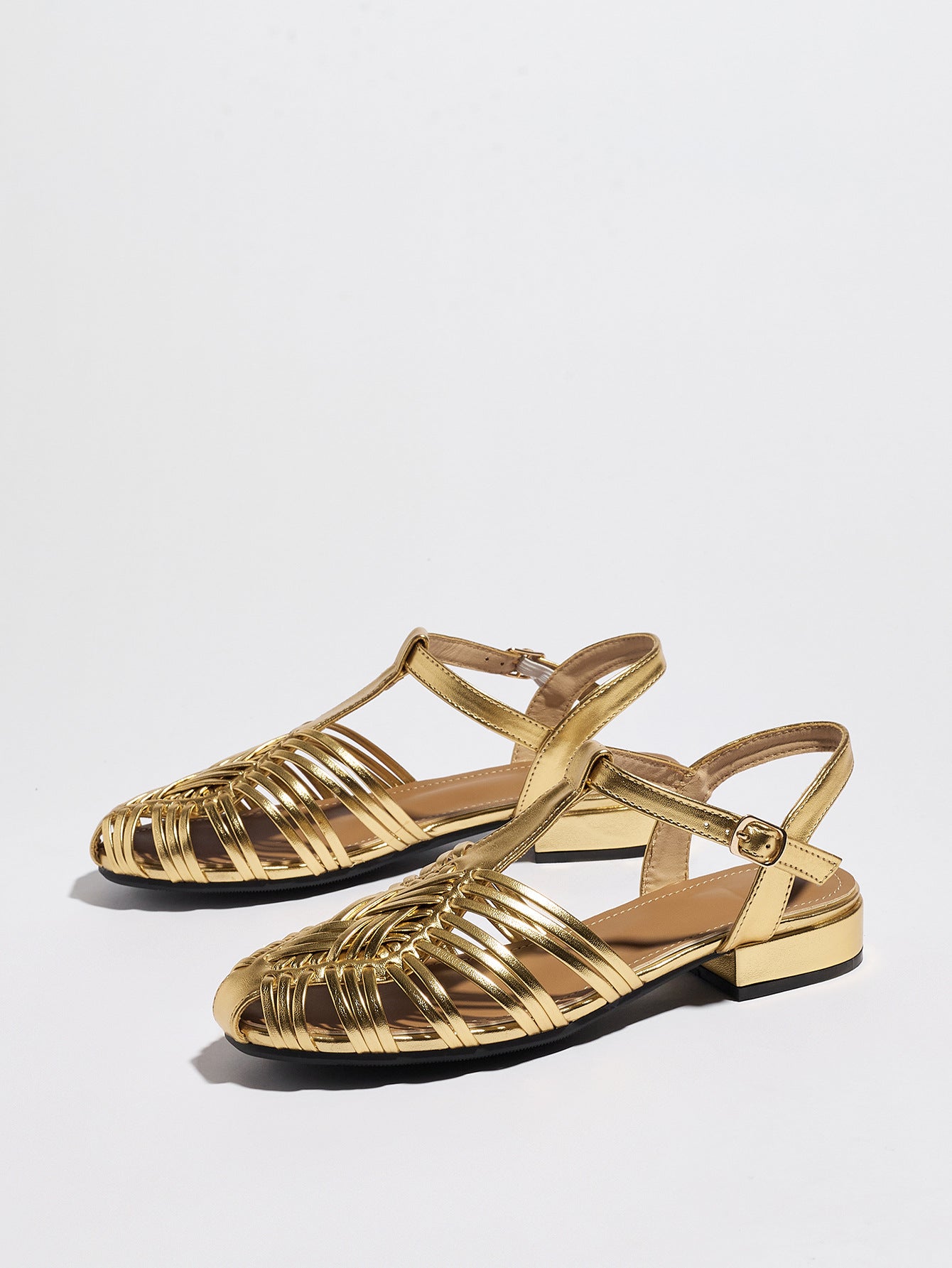 Mescini gold woven closed toe block heel sandals, pair viewed from above at an angle, US women's sizes