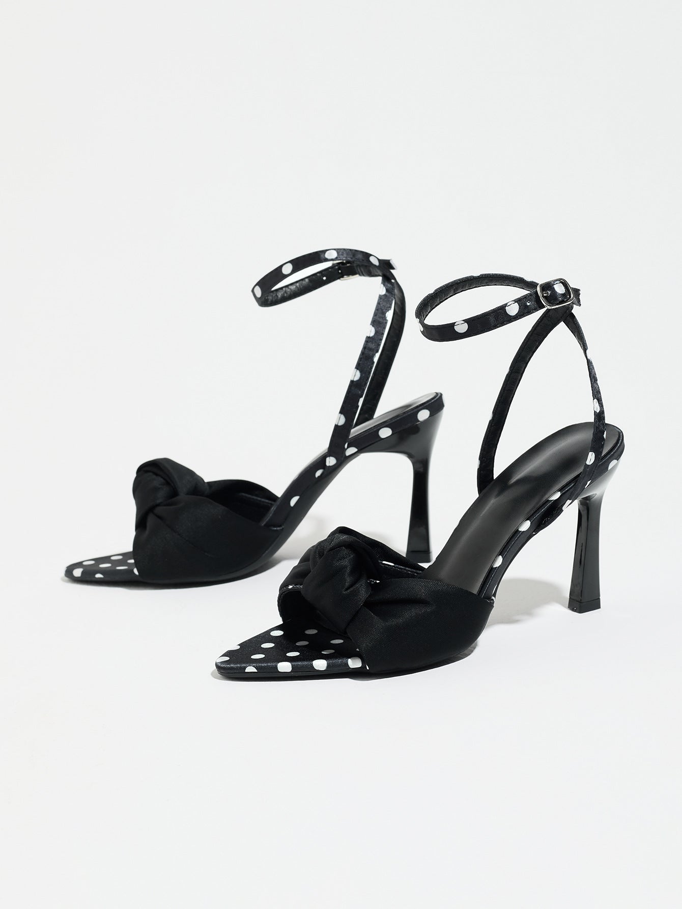 Mescini black knot front polka dot heeled sandals, angled pair on a white background, US women's sizes