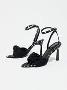 Mescini black knot front polka dot heeled sandals, angled pair on a white background, US women's sizes