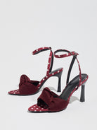 Mescini burgundy knot front polka dot heeled sandals, pair standing on a pale grey surface, US women's sizes