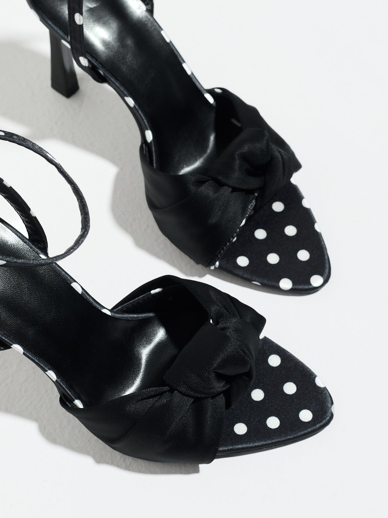 Mescini black knot front polka dot heeled sandals, close up of the knotted toe band, US women's sizes