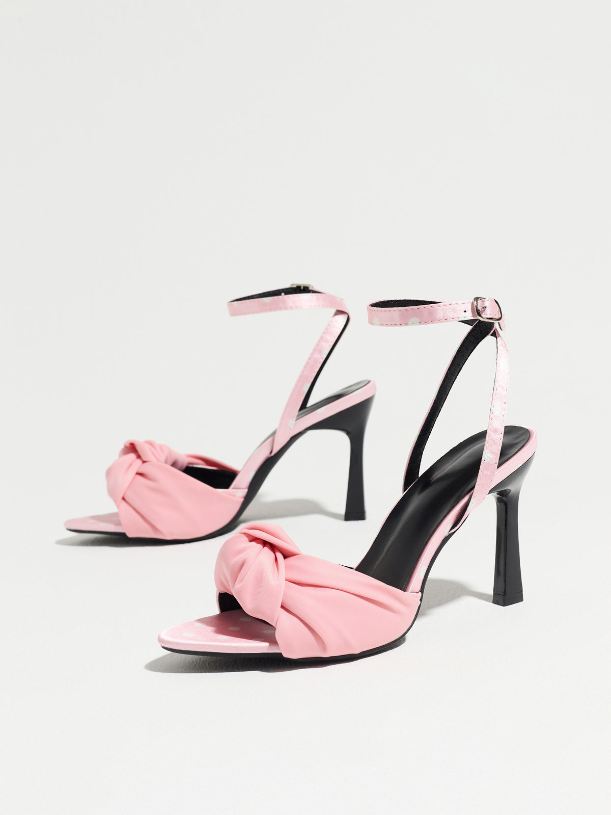Mescini pink knot front polka dot heeled sandals, pair standing at an angle on white, US women's sizes