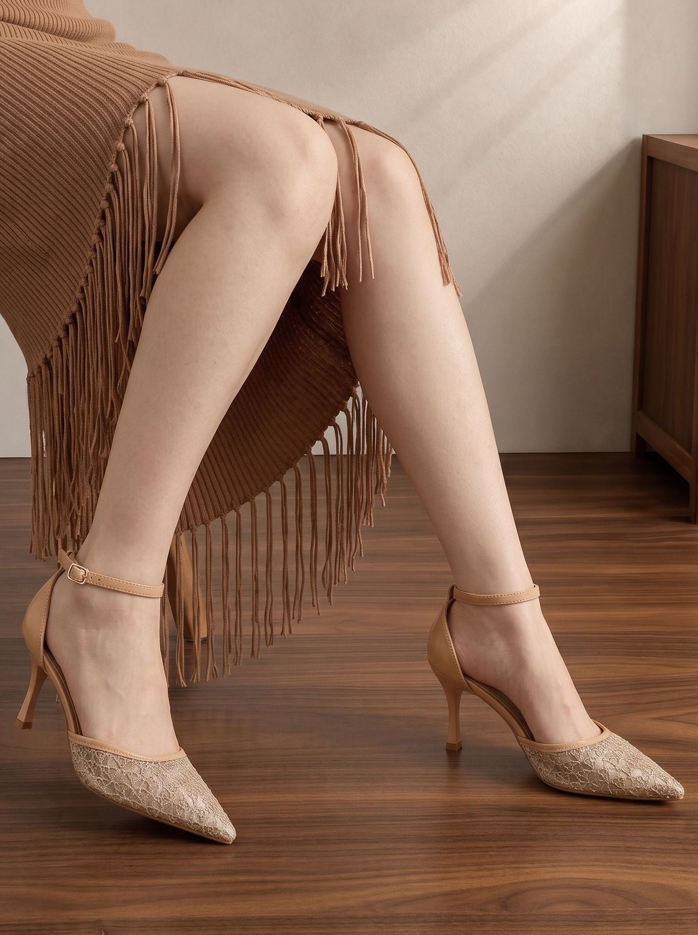 Mescini apricot embroidered mesh ankle strap pumps worn under a fringed skirt, US women's sizes