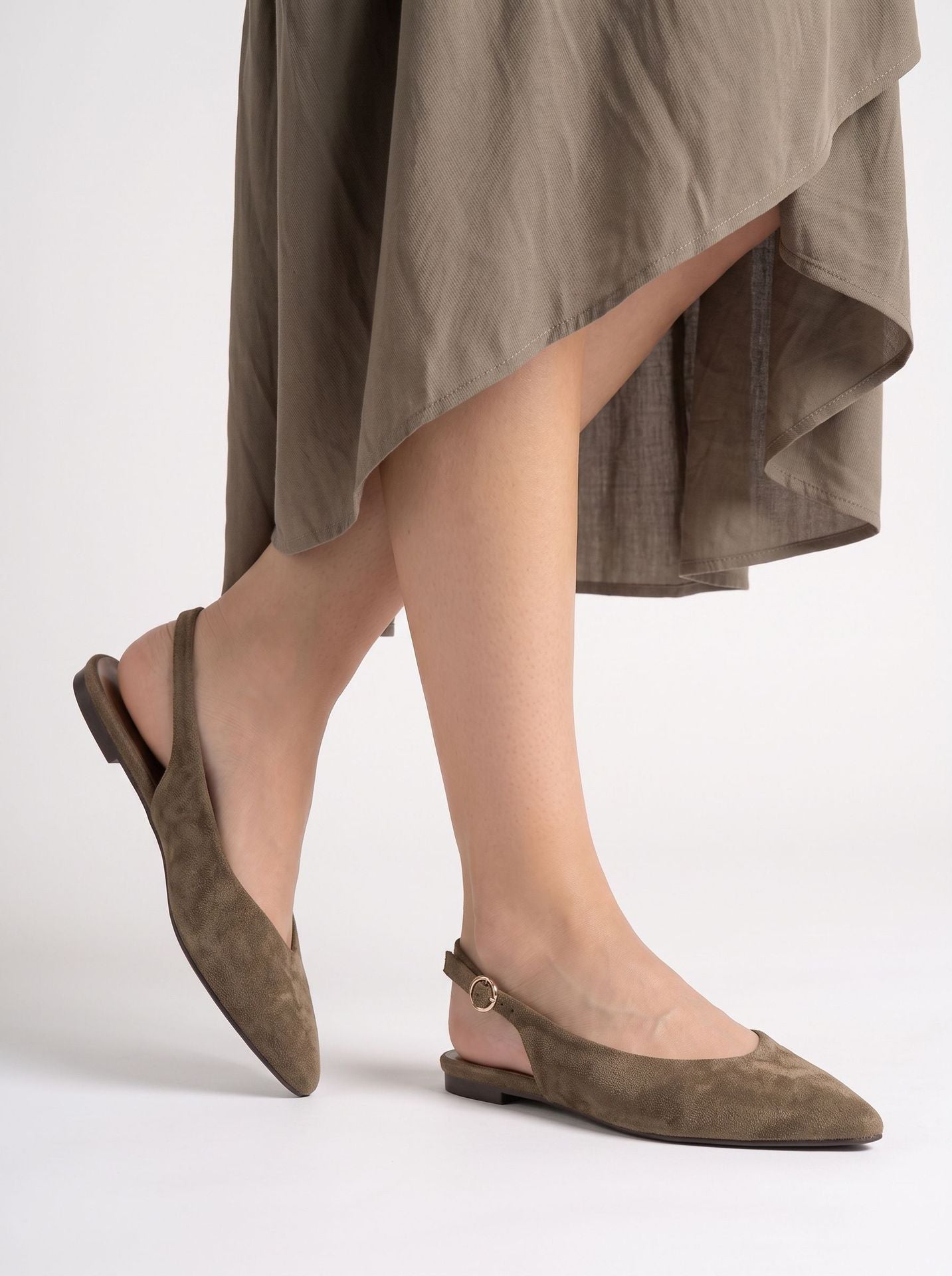Mescini brown pointed toe slingback ballet flats, worn by a model walking, side view, US women's sizes