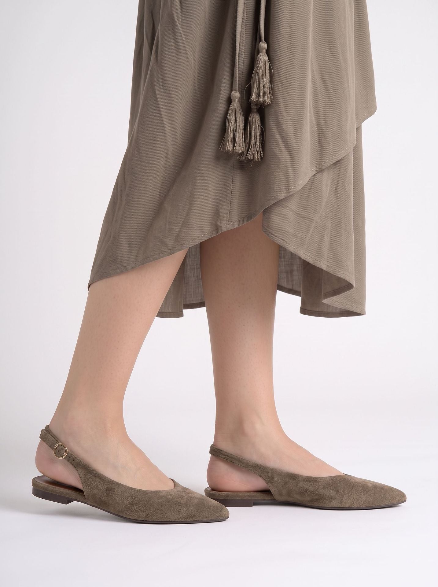 Mescini brown pointed toe slingback ballet flats, worn under a long olive dress, US women's sizes