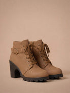 Mescini brown lace up combat ankle boots with buckle strap and lug sole, angled pair view