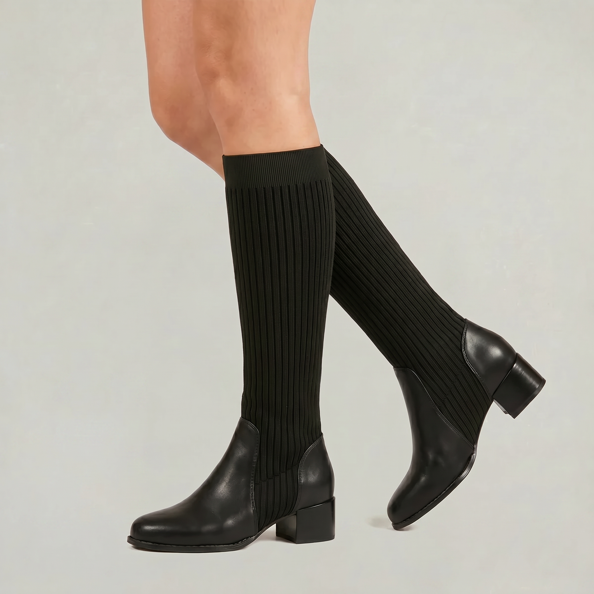 Mescini - black knit knee high boots on the model, block heel seen from behind, US women's sizes