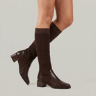 Mescini - dark brown knit knee high boots on the model, back heel lifted, US women's sizes