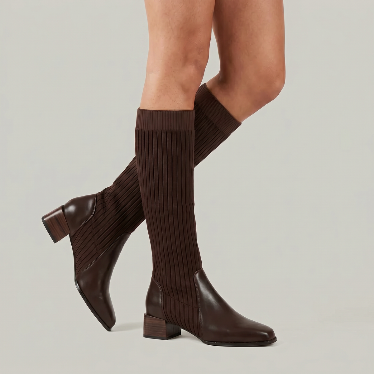 Mescini - dark brown knit knee high boots on the model, back heel lifted, US women's sizes