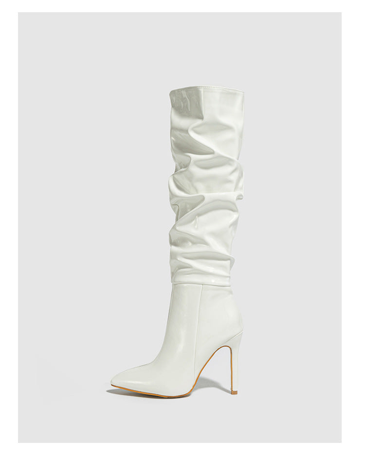 Mescini white ruched patent knee high stiletto boots, single boot on a grey background, US women's sizes