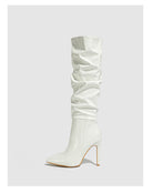 Mescini white ruched patent knee high stiletto boots, single boot on a grey background, US women's sizes