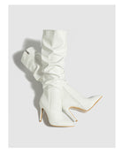 Mescini white ruched patent knee high stiletto boots, pair angled in the studio, US women's sizes