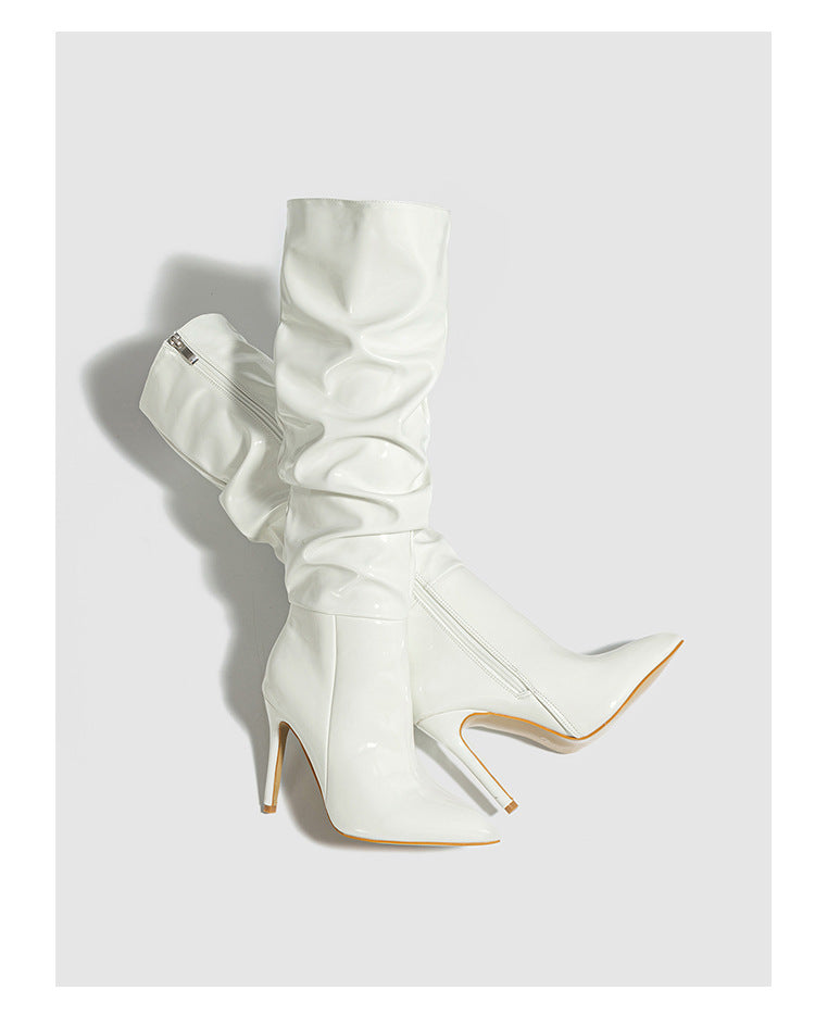 Mescini white ruched patent knee high stiletto boots, pair angled in the studio, US women's sizes