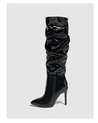 Mescini black ruched patent knee high stiletto boots, single boot on a grey background, US women's sizes