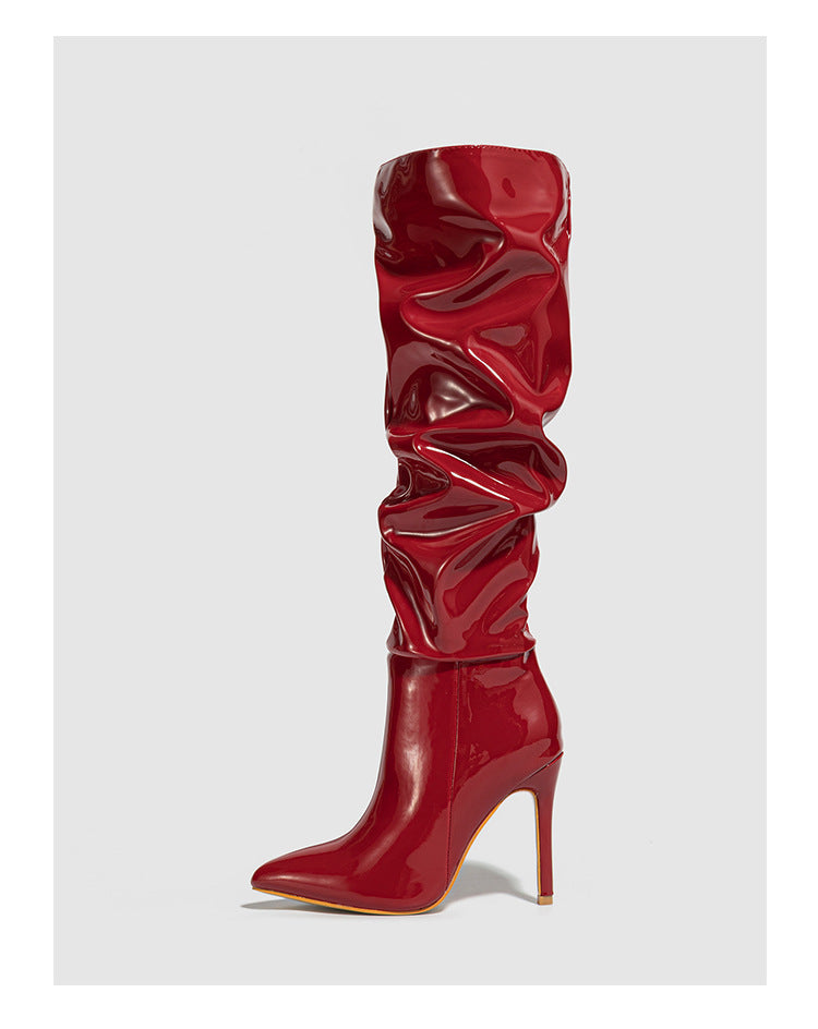 Mescini red ruched patent knee high stiletto boots, single boot on a grey background, US women's sizes