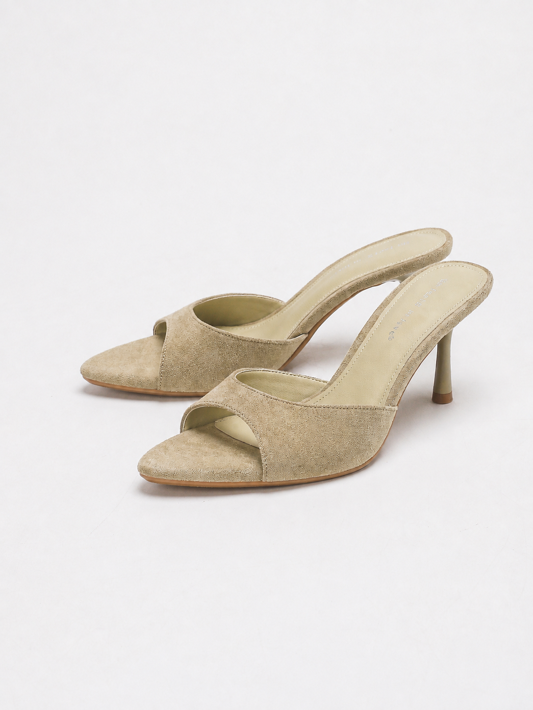 Mescini beige pointed open toe suede stiletto mules, the pair angled on white, US women's sizes