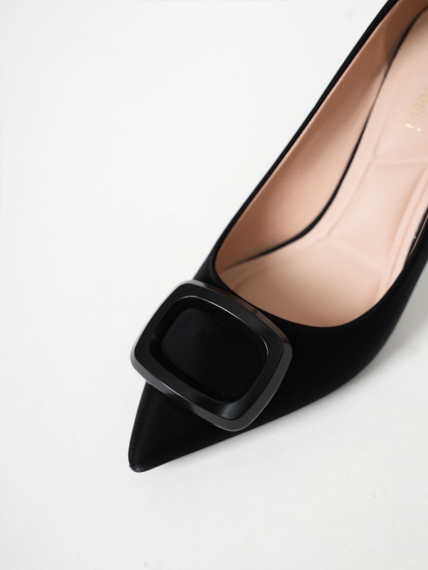 Mescini black square ring pointed toe pumps, close up of the metal ornament, US women's sizes