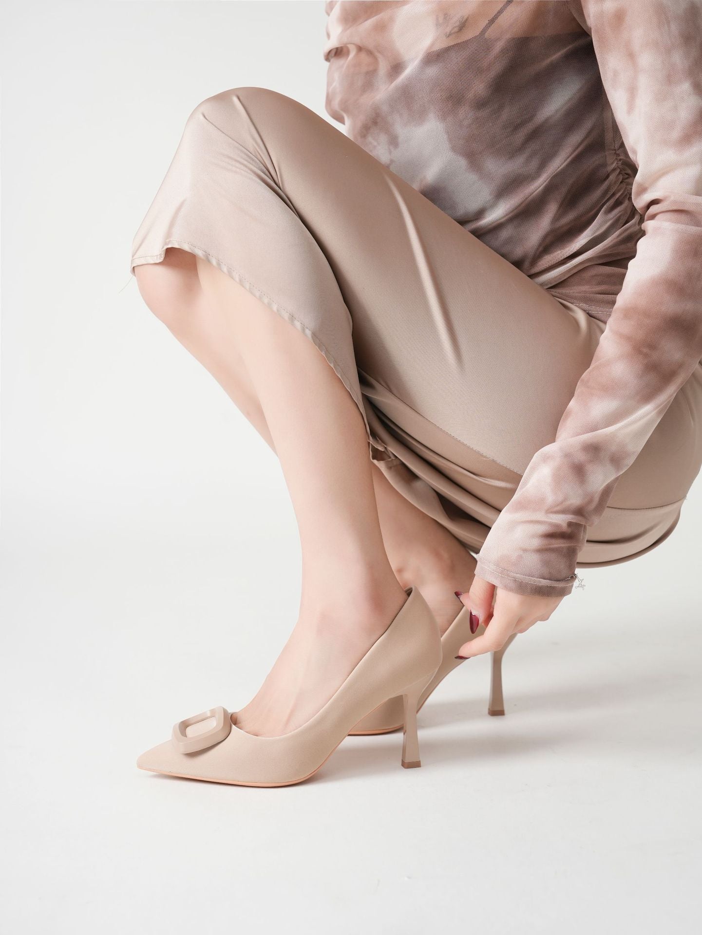 Mescini beige square ring pointed toe pumps, model reaching down to the heel, US women's sizes