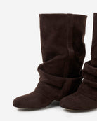Mescini dark chocolate slouchy mid calf boots, one upright, one on its side, US sizes