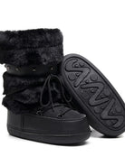 Mescini black faux fur studded platform snow boots, one shoe tipped to show the tread, US women's sizes