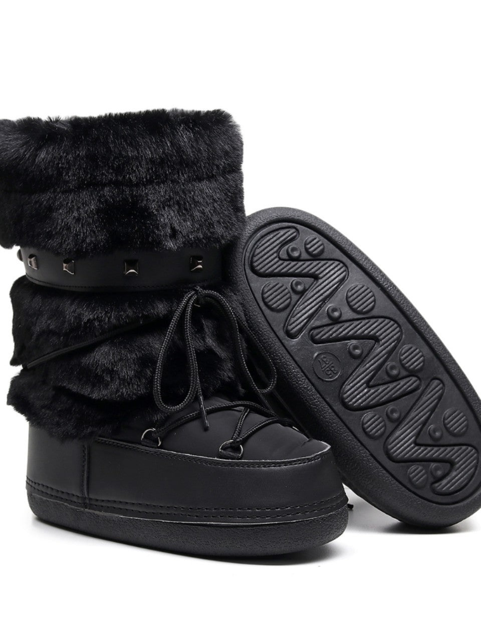 Mescini black faux fur studded platform snow boots, one shoe tipped to show the tread, US women's sizes