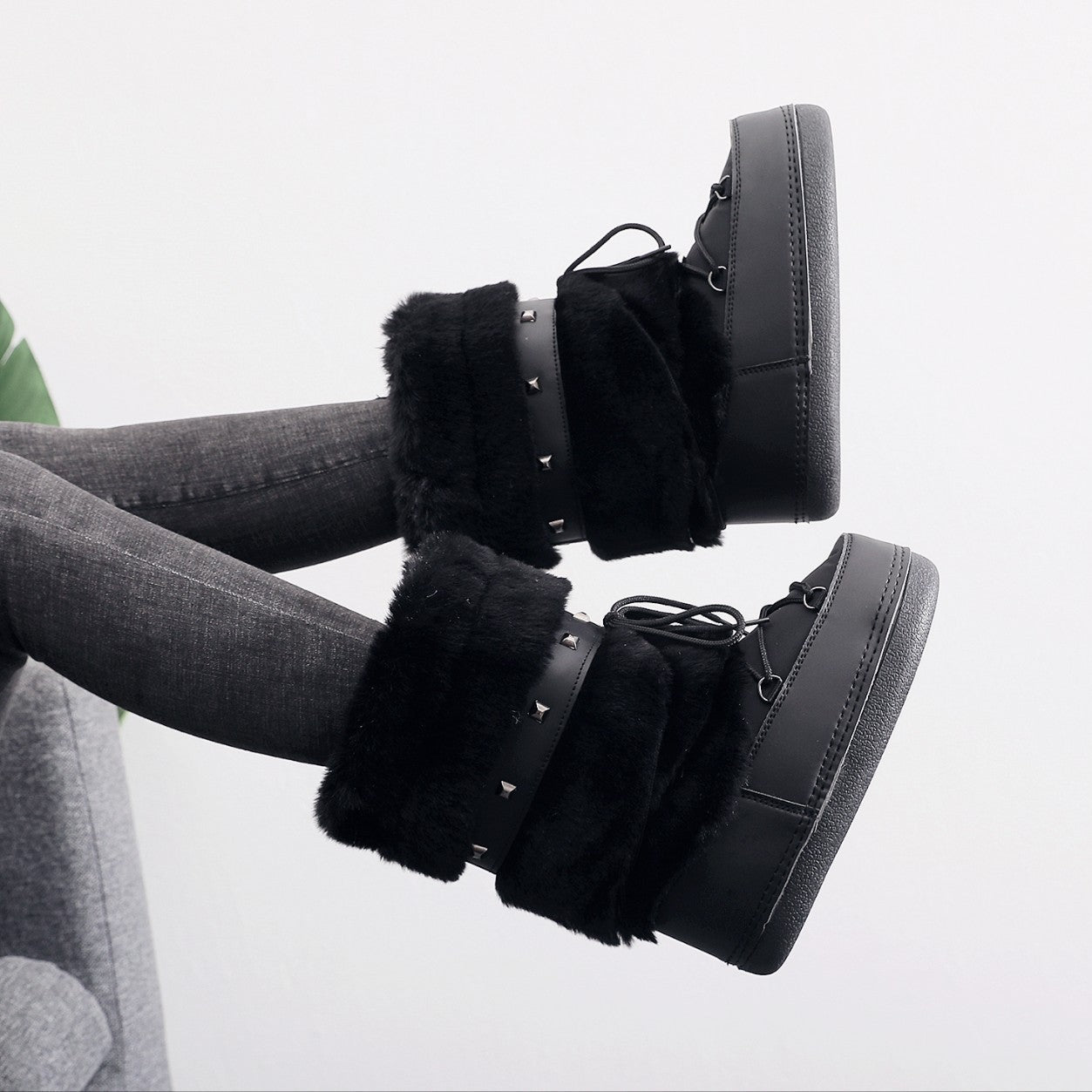 Mescini - black faux fur snow boots worn with grey jeans, lifestyle shot, US women's sizes