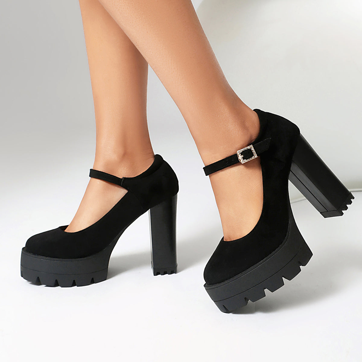 Mescini black platform Mary Jane block heel pumps worn mid stride, side view, US women's sizes