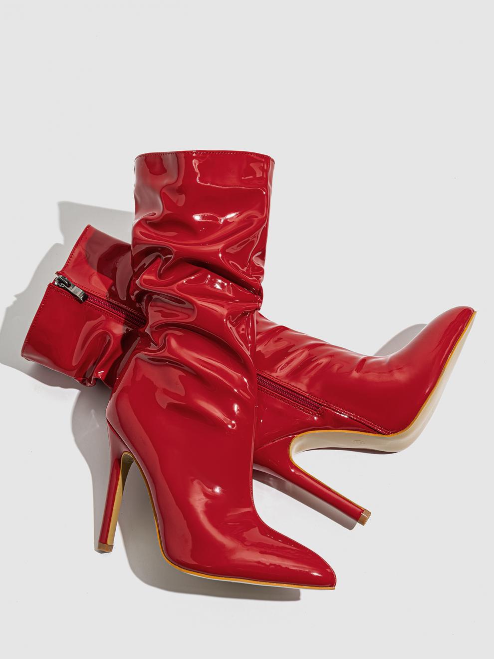 Mescini red slouchy patent mid calf boots, the pair resting on their sides on grey, US women's sizes