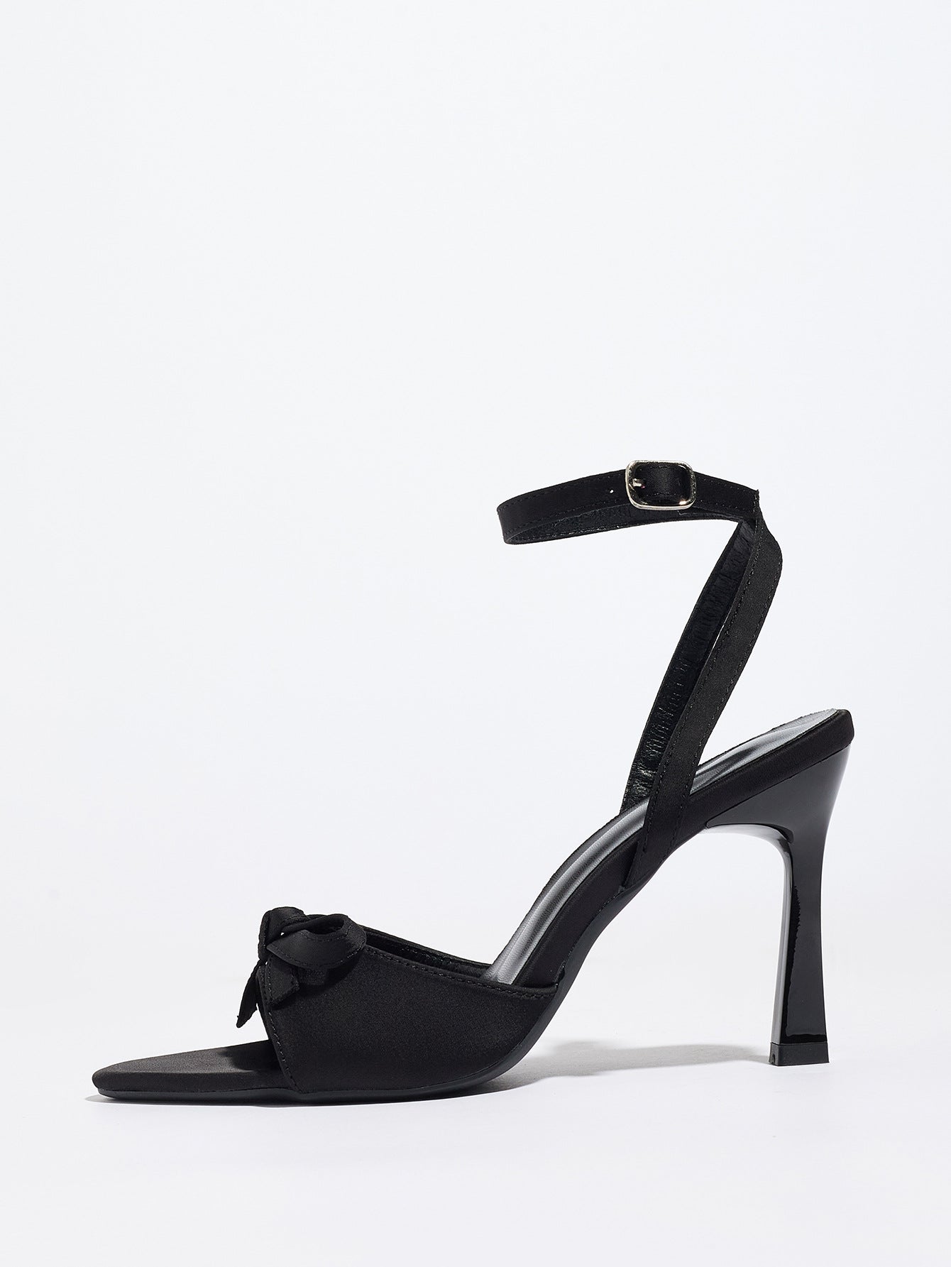Mescini black satin bow ankle strap sandals, single shoe seen from the side, US women's sizes